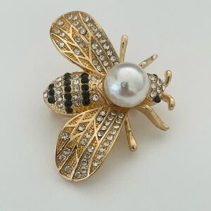 Elegant Gold tone and Black Bee Brooch with Pearl Accent